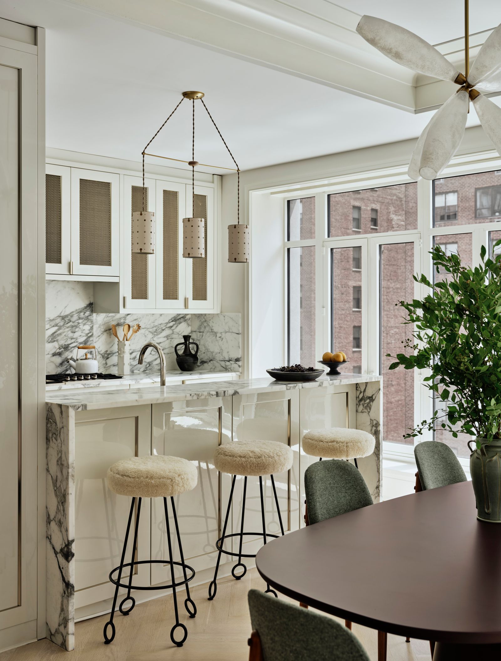 Image may contain Indoors Interior Design Dining Table Furniture Table Chair Kitchen Appliance and Ceiling Fan