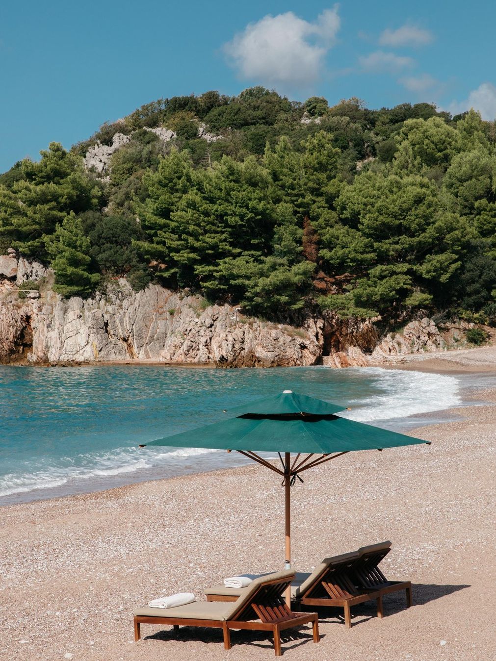 Image may contain Beach Coast Nature Outdoors Sea Shoreline Water Scenery Chair and Furniture