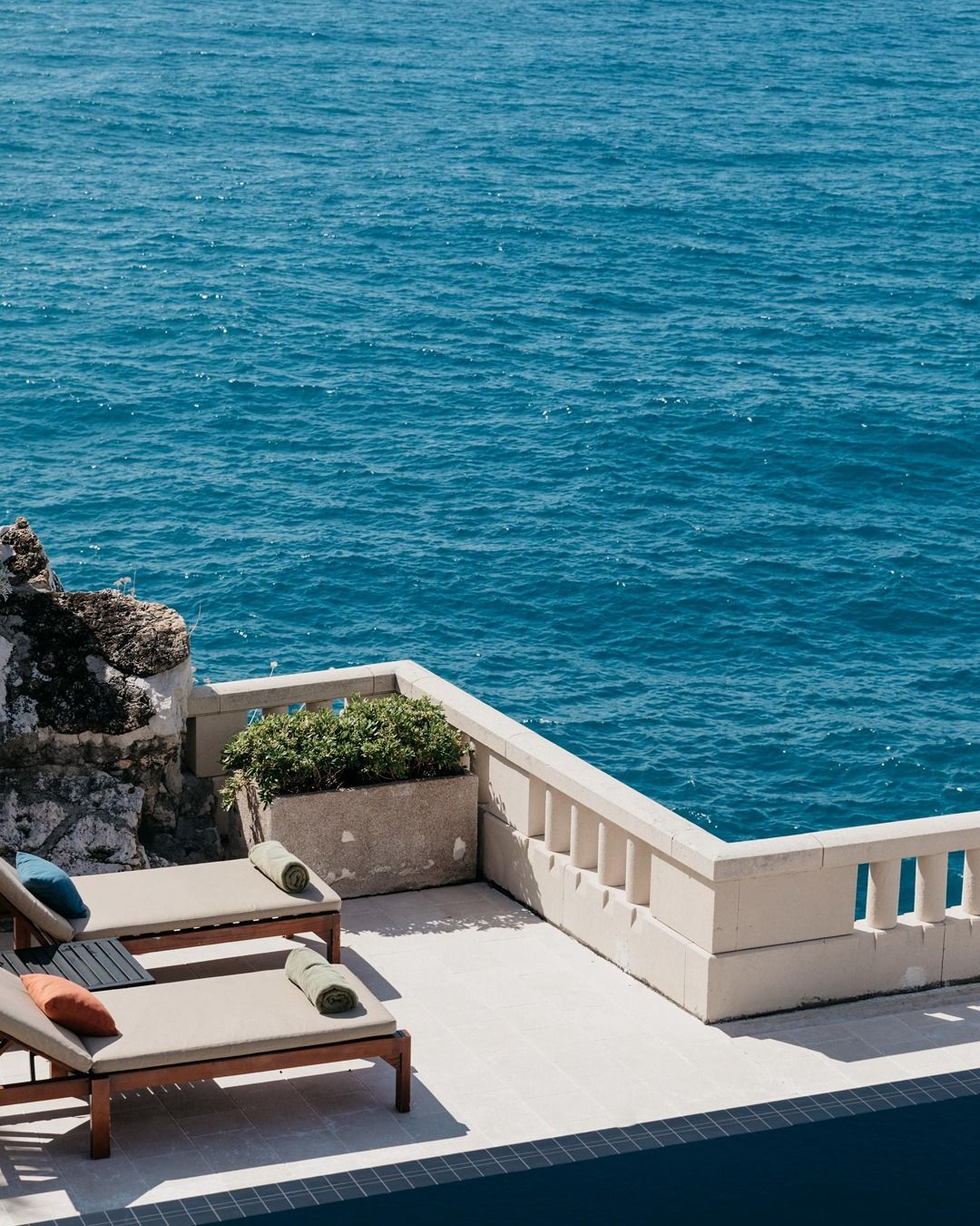 Image may contain Nature Outdoors Sky Horizon Plant Scenery Pool Water and Furniture