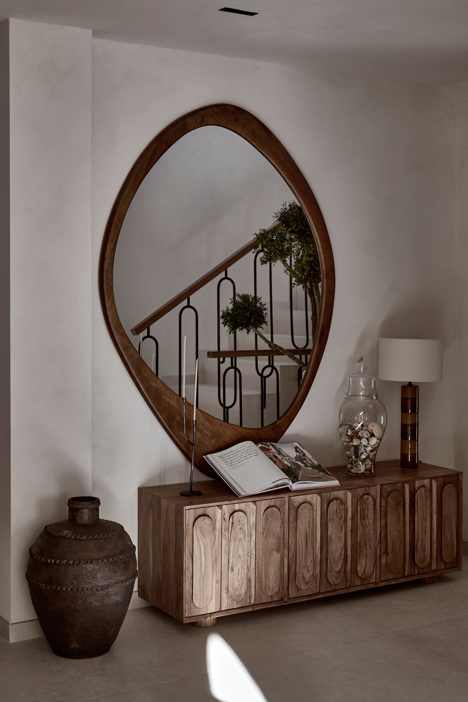 Image may contain Book Publication Indoors Interior Design Lamp Wood Plant Hardwood Stained Wood and Architecture