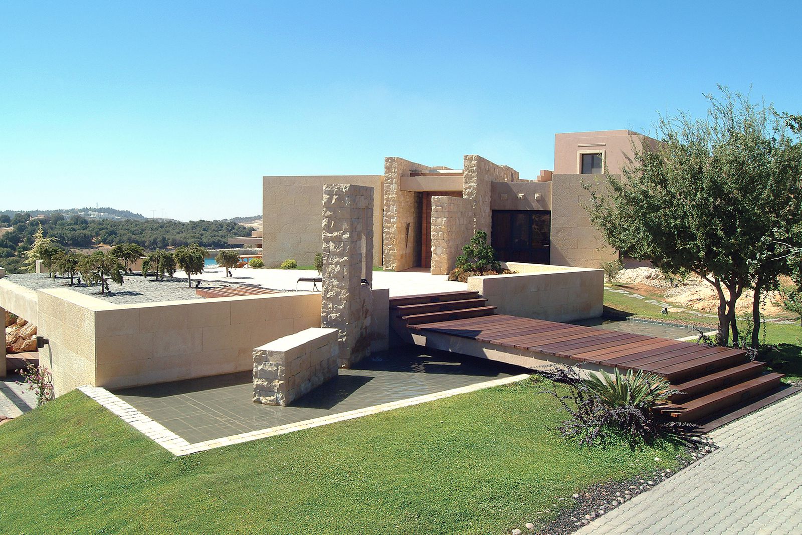 Image may contain Architecture Building House Housing Villa Grass Plant Terrace Backyard Nature Outdoors and Yard