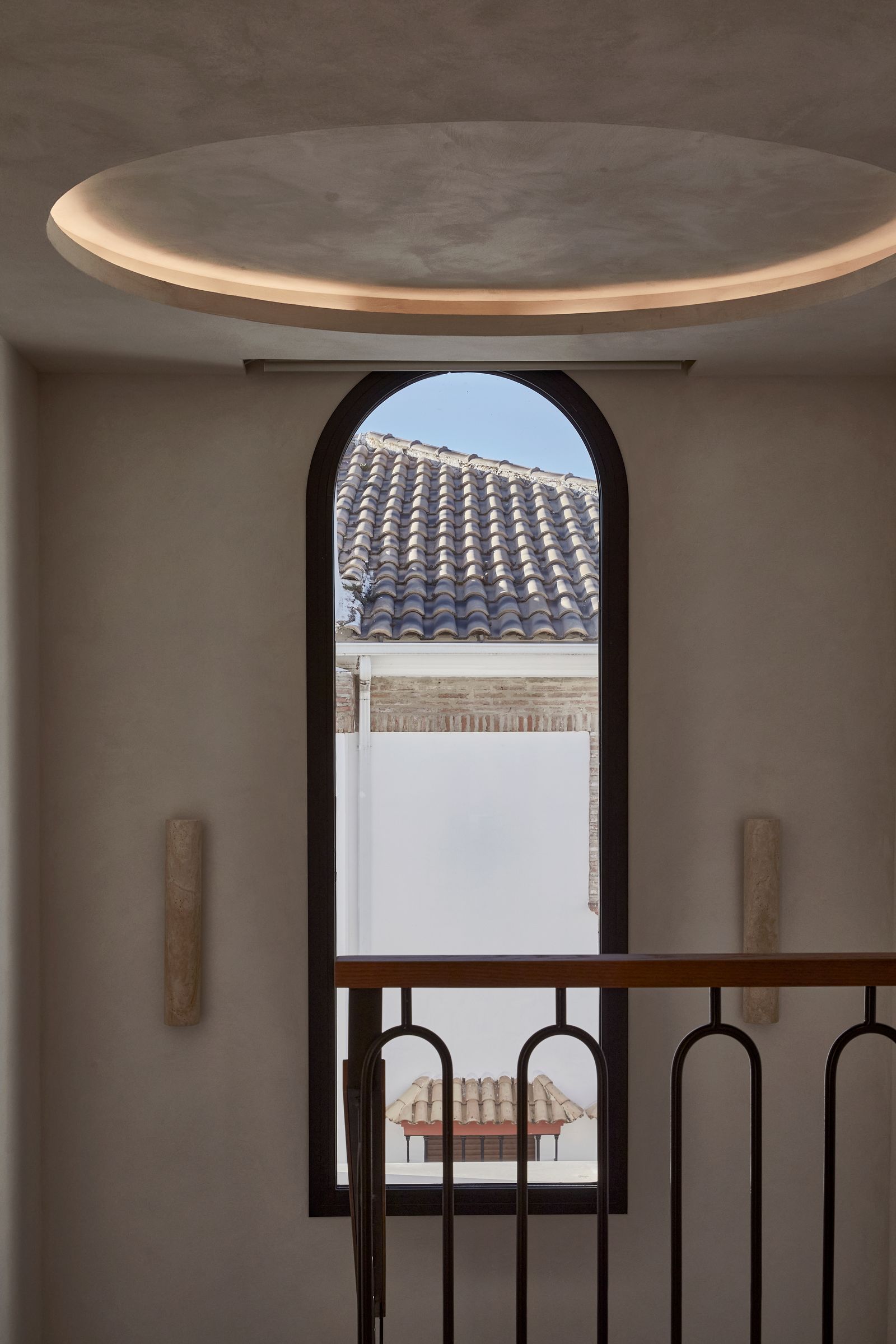 Image may contain Arch Architecture Balcony Building and Window