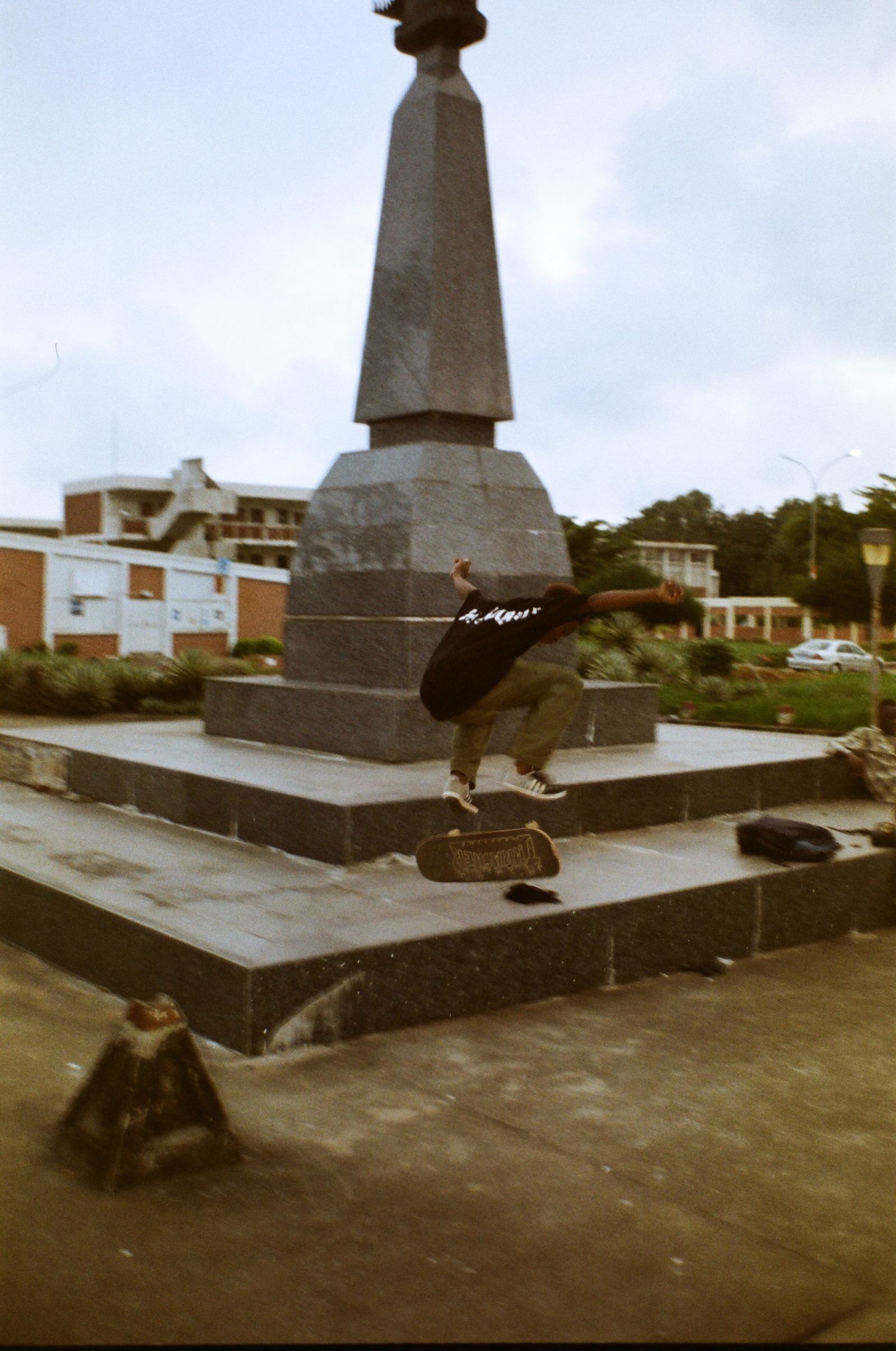 Image may contain Architecture Building Monument Neighborhood Clothing Footwear Shoe Person City and Car