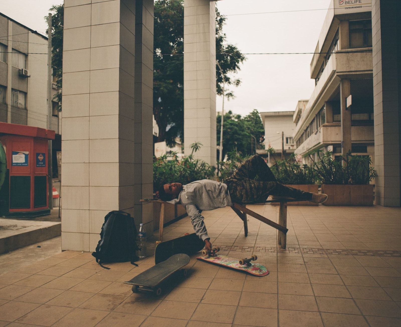 Image may contain Child Person Backpack Bag Skateboard and City