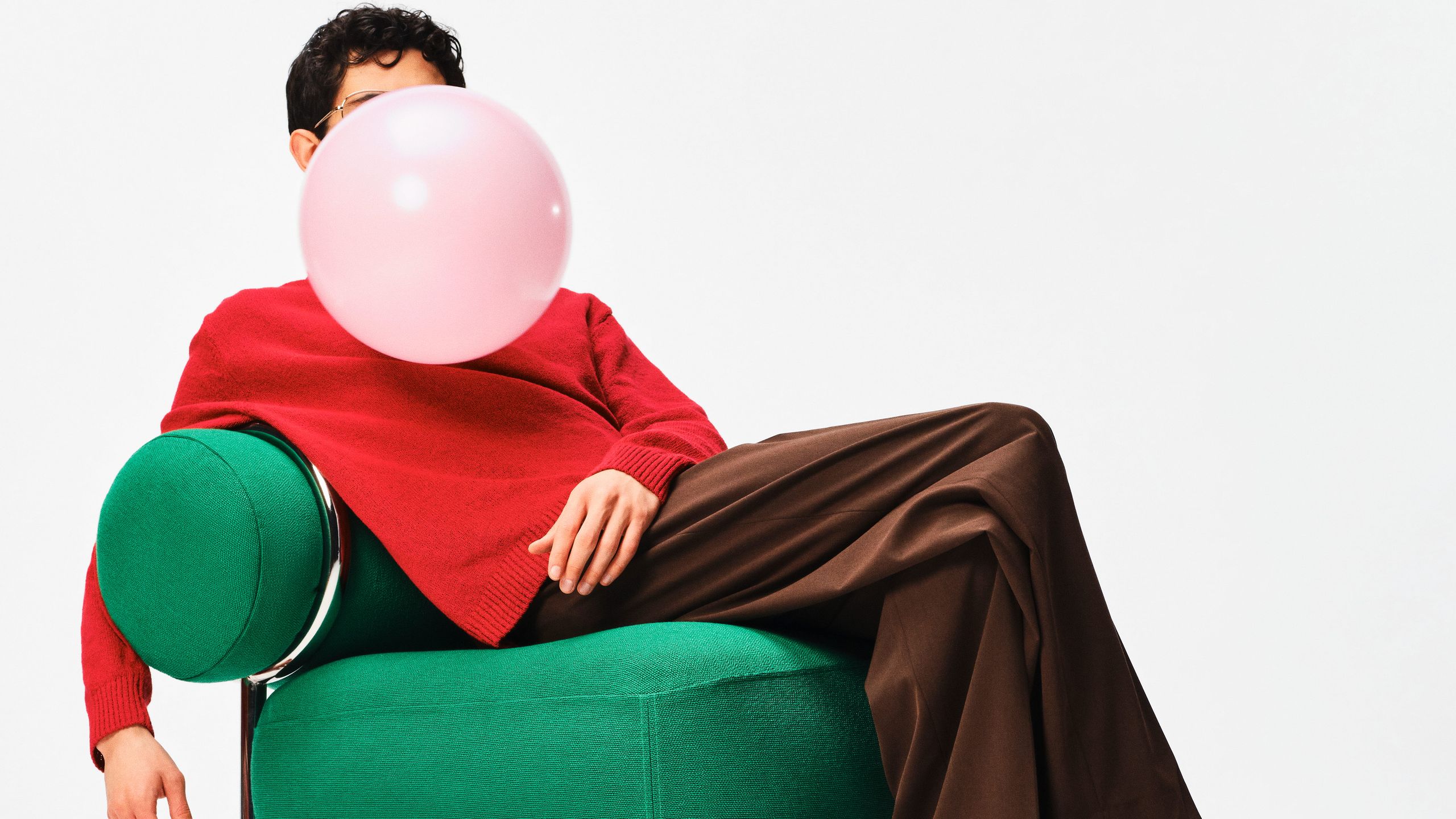 Image may contain Person Sitting Clothing Footwear Shoe Furniture Balloon and Adult
