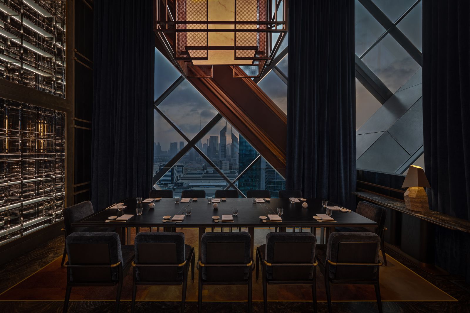 Image may contain Architecture Building Cityscape Urban Chair Furniture Indoors Cup People Person and City