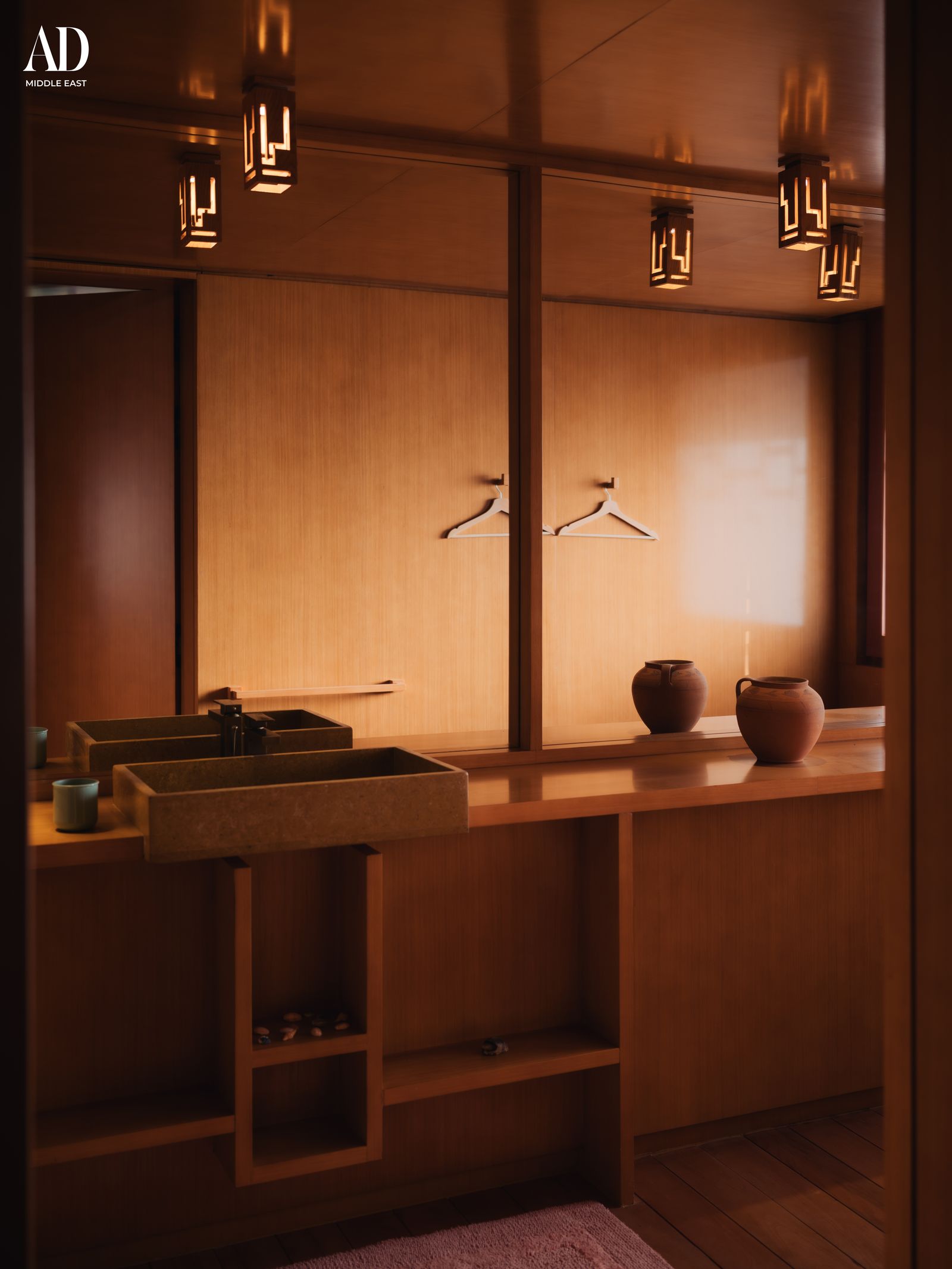 Image may contain Indoors Interior Design Sink Closet Cupboard Furniture Home Decor Rug and Wood