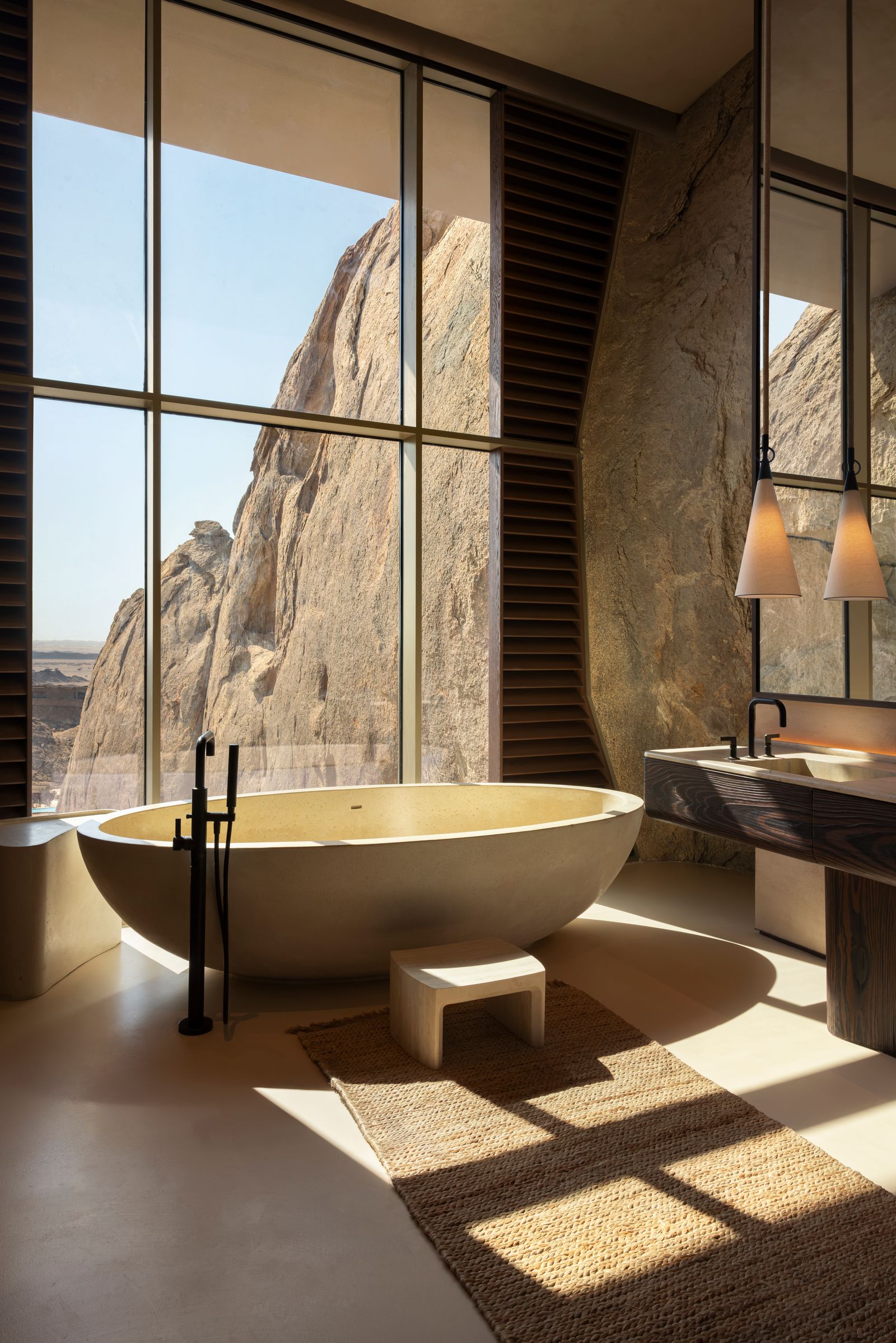 desert rock has rock cave suite rocky walls in the bathroom with freestanding bathtub overlooking the mountains. Review...